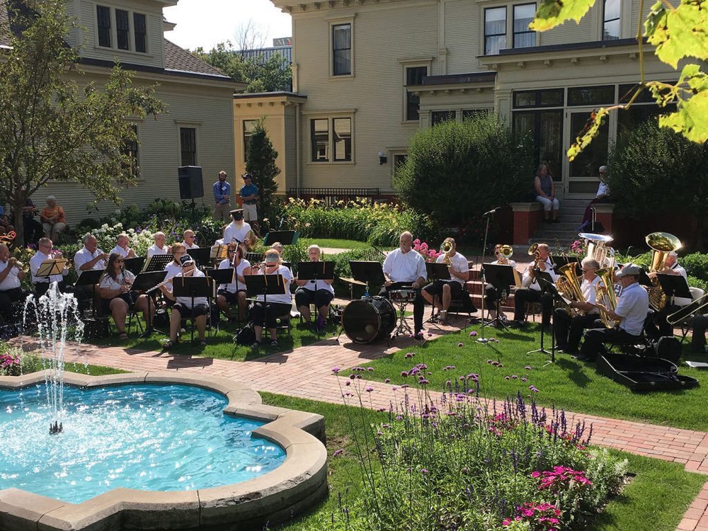 A band playing near a fountain